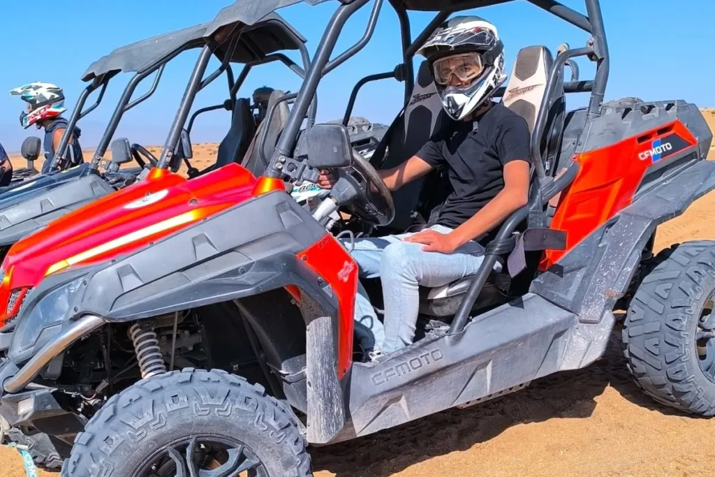 Buggy Agadir action shot with driver drifting on orange sand dunes