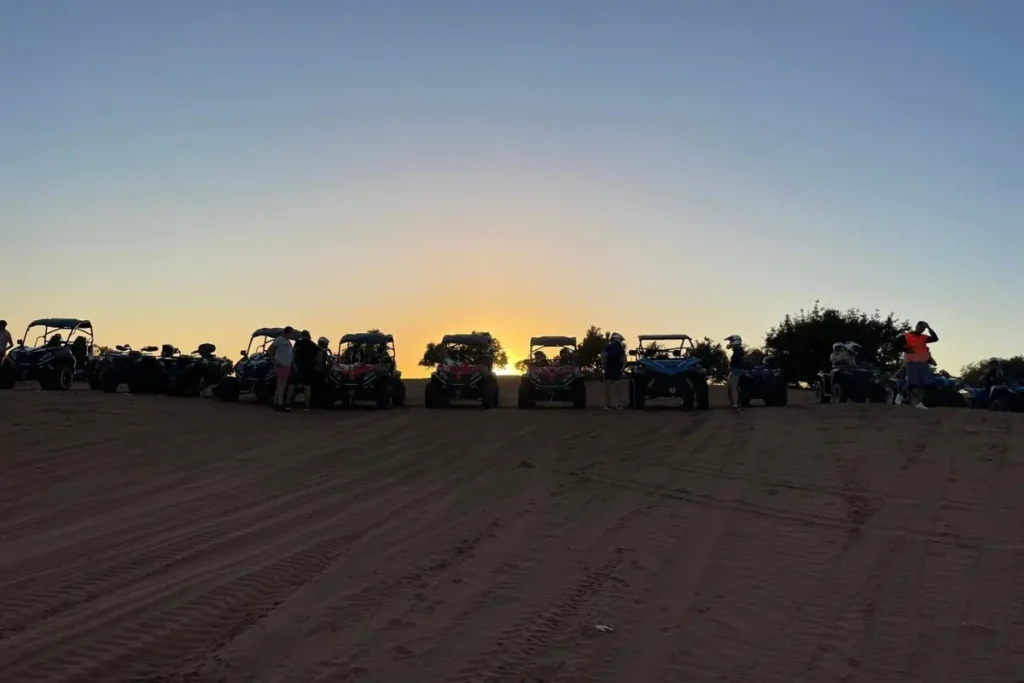 Buggy Agadir sunset ride with multiple buggies and travelers in the desert