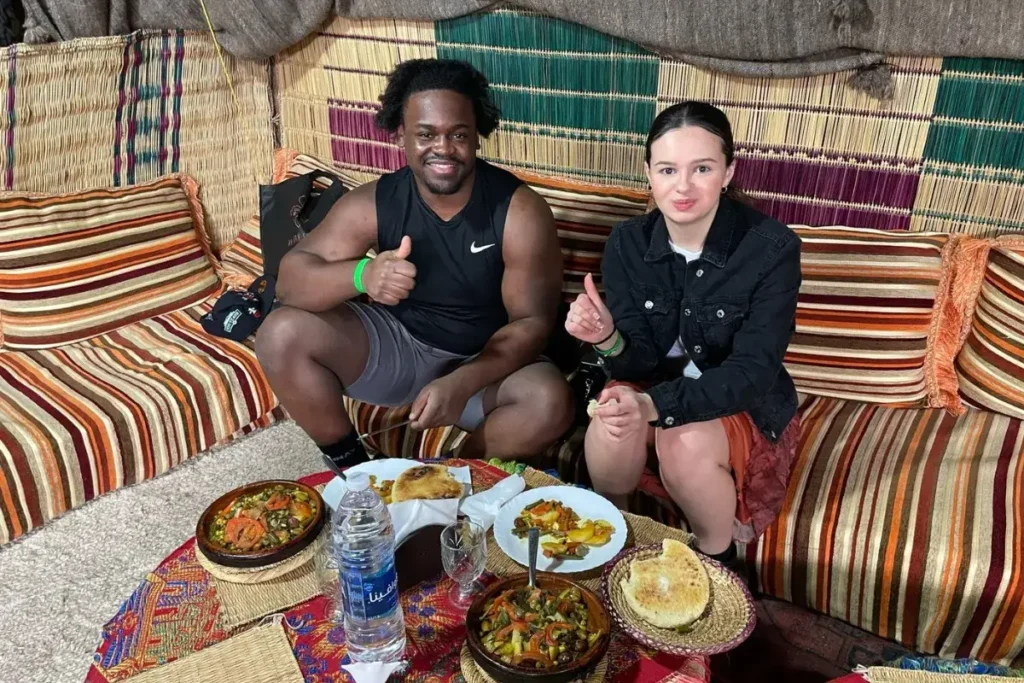 Couple enjoying Moroccan dishes they cooked in an Agadir Cooking Class