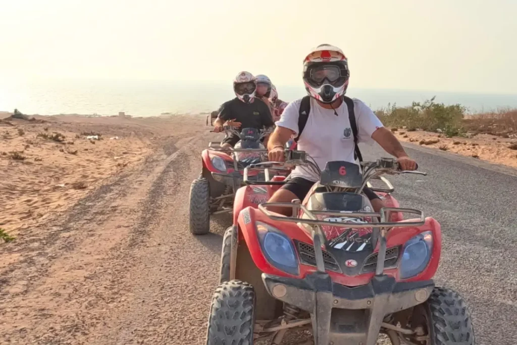 Riders cruising the beach on a fun-filled Quad Agadir tour