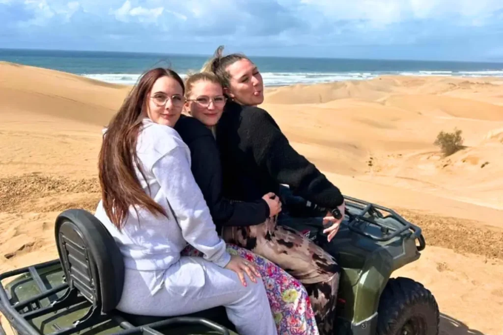 Three friends enjoying the view on a Quad Agadir dunes ride