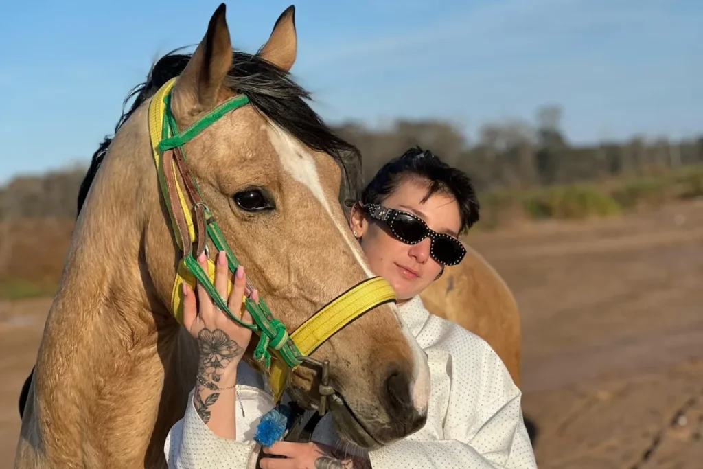 Tourist hugging a horse before a ride – Horse Riding Agadir