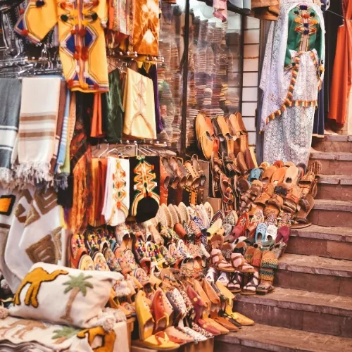 Traditional Moroccan souk visited on the Agadir City Tour with babouches and crafts