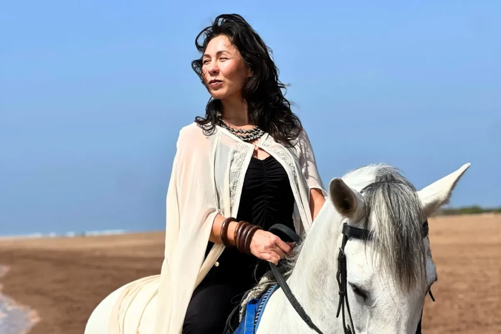 Woman horse riding in Agadir during a beautiful beach sunset – Horse Riding Agadir