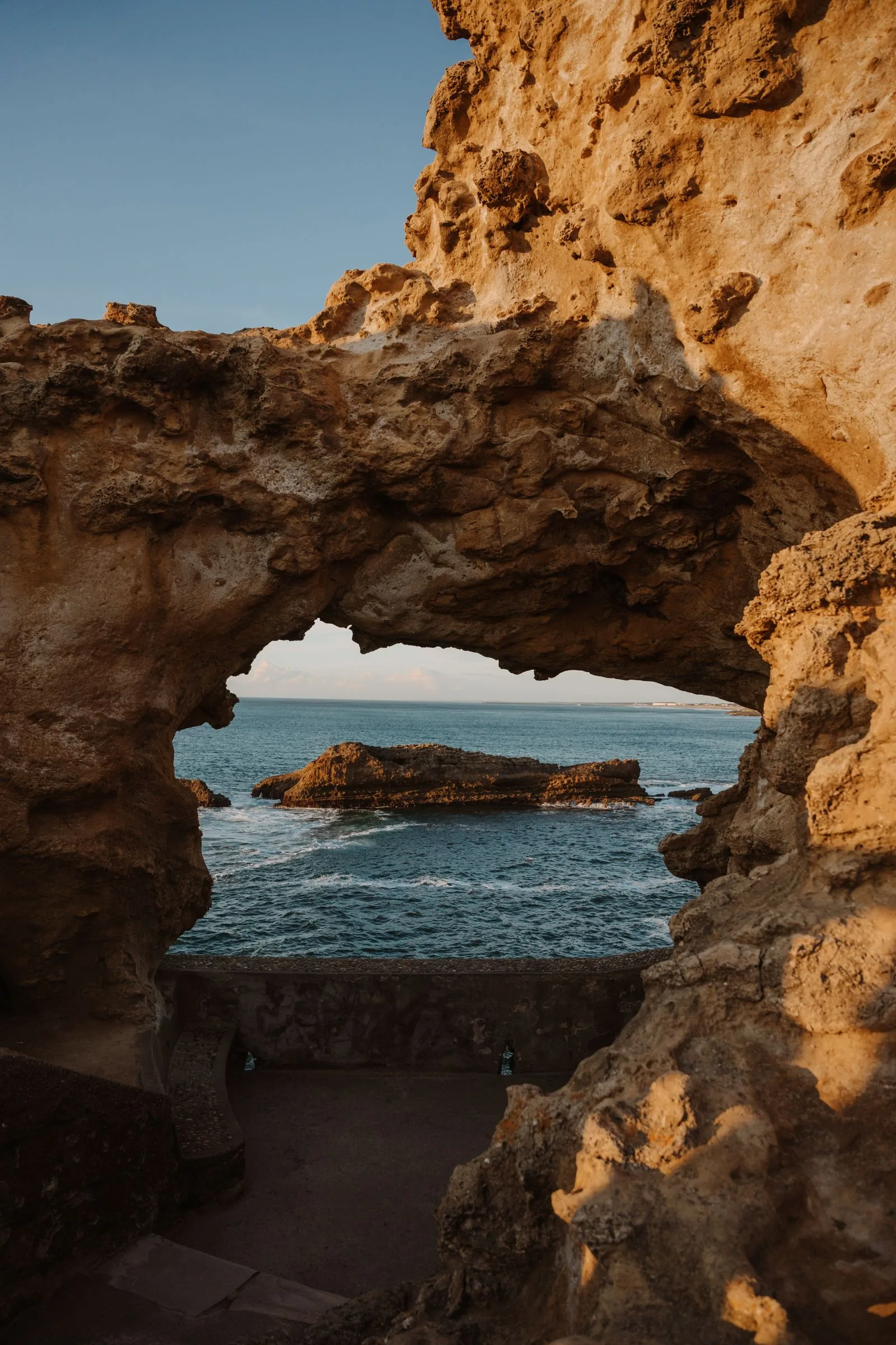 Legzira beach red rock arch on the Atlantic coast at sunset
