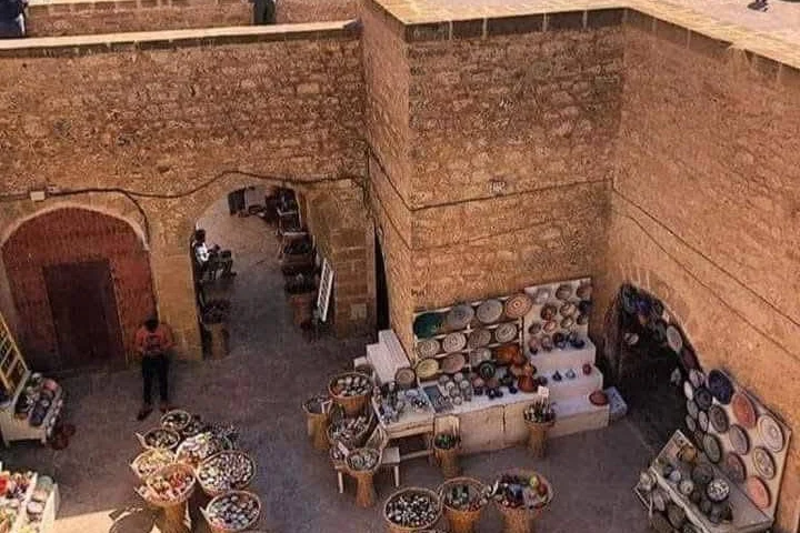 Aerial view over the Essaouira ramparts with pottery stalls and the ocean beyond