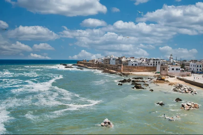 Walled coastal city of Essaouira with waves crashing along the ramparts